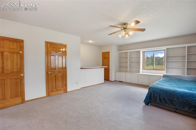390 E Stirrup Trl, Monument, CO 80132 - bedroom featuring carpet, a textured ceiling, baseboards, and ceiling fan