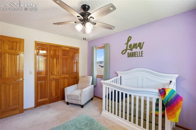 390 E Stirrup Trl, Monument, CO 80132 - bedroom with carpet floors, a closet, ceiling fan, and a textured ceiling