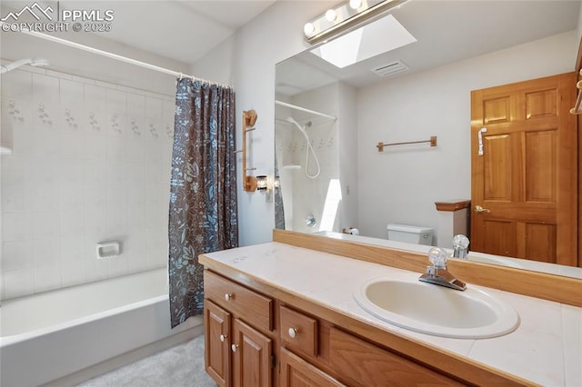 390 E Stirrup Trl, Monument, CO 80132 - bathroom featuring vanity, toilet, shower / tub combo, and a skylight