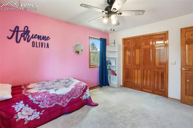 390 E Stirrup Trl, Monument, CO 80132 - carpeted bedroom with a closet, baseboards, and ceiling fan