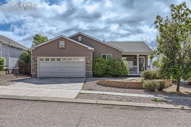6491 Ferndale Dr, Colorado Springs, CO 80923 - ranch-style house featuring stucco siding, driveway, an attached garage, and stone siding