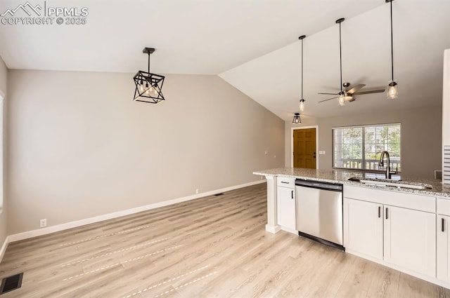6491 Ferndale Dr, Colorado Springs, CO 80923 - kitchen with stainless steel dishwasher, a sink, lofted ceiling, light wood-type flooring, and white cabinetry
