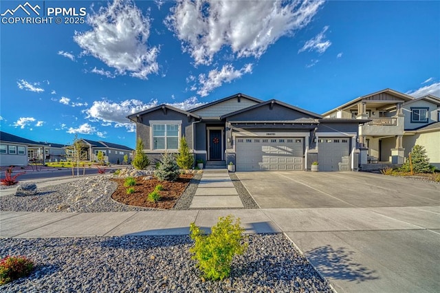 9473 Bugaboo Dr, Colorado Springs, CO 80924 - view of front of house with stucco siding, driveway, and a garage