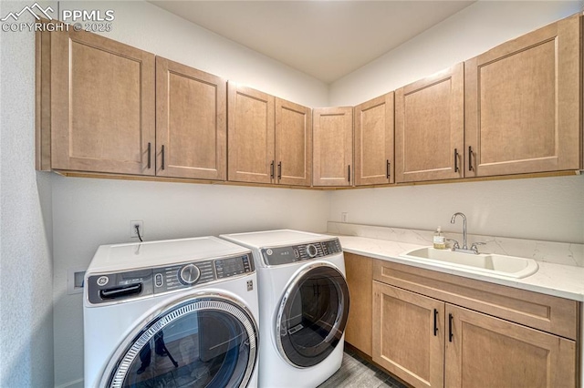 9473 Bugaboo Dr, Colorado Springs, CO 80924 - laundry area with washer and dryer, cabinet space, and wood finished floors