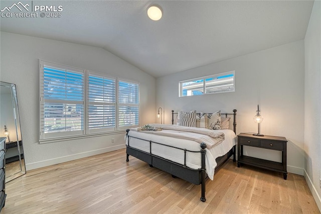9473 Bugaboo Dr, Colorado Springs, CO 80924 - bedroom with lofted ceiling, light wood-style flooring, and baseboards
