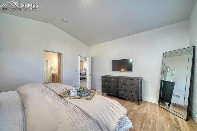 9473 Bugaboo Dr, Colorado Springs, CO 80924 - bedroom with lofted ceiling, light wood-style floors, and baseboards