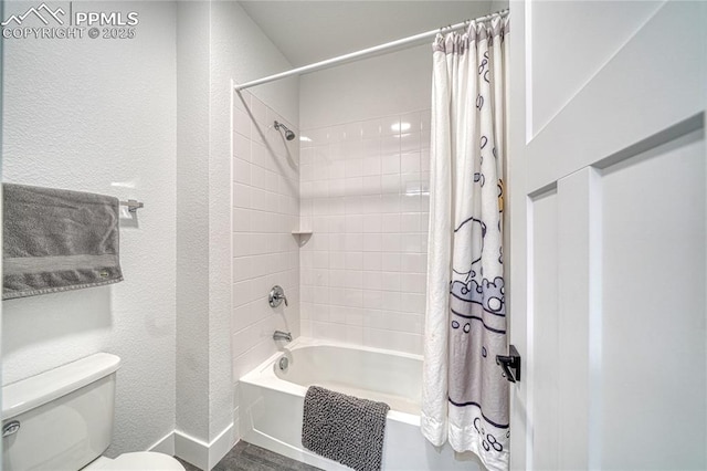 9473 Bugaboo Dr, Colorado Springs, CO 80924 - full bath featuring toilet, shower / tub combo, and a textured wall