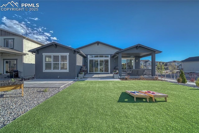9473 Bugaboo Dr, Colorado Springs, CO 80924 - back of house featuring a patio area, a lawn, and stucco siding