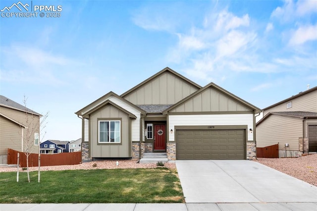 12879 Morning Creek Ln, Peyton, CO 80831 - craftsman house with board and batten siding, a garage, stone siding, and driveway