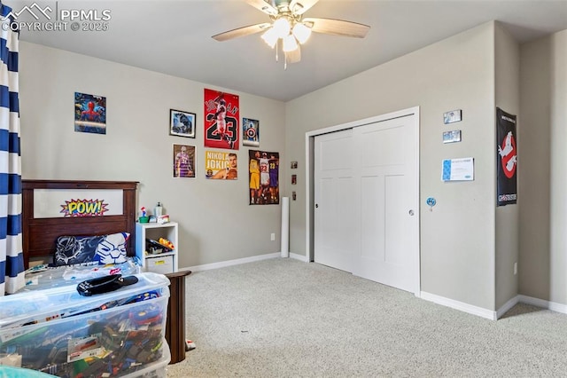 12879 Morning Creek Ln, Peyton, CO 80831 - bedroom featuring carpet floors, baseboards, a ceiling fan, and a closet