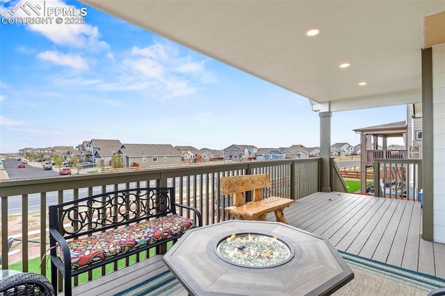 12879 Morning Creek Ln, Peyton, CO 80831 - deck with a residential view and a fire pit