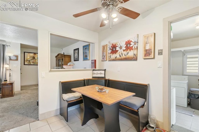 1409 Evergreen Dr, Colorado Springs, CO 80911 - dining area featuring washer / clothes dryer, ceiling fan, light tile patterned floors, and baseboards