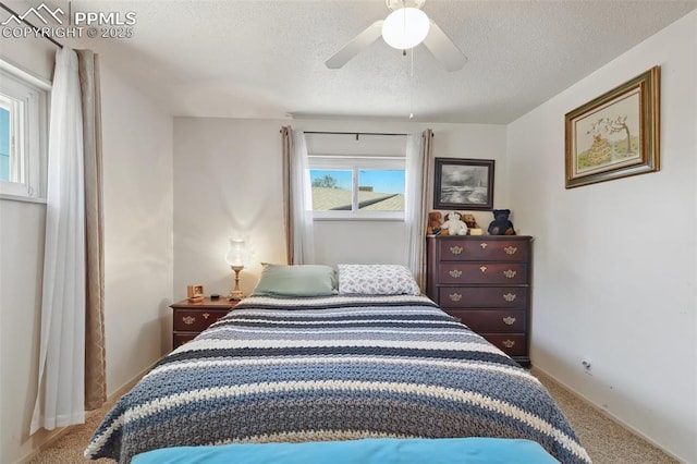 1409 Evergreen Dr, Colorado Springs, CO 80911 - carpeted bedroom with a textured ceiling, ceiling fan, and baseboards