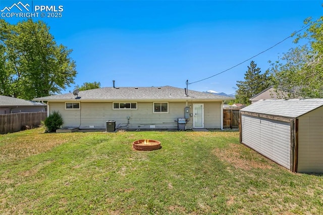 1409 Evergreen Dr, Colorado Springs, CO 80911 - back of property featuring an outdoor fire pit and central air condition unit