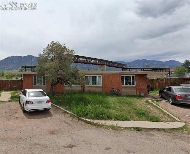 346 Fairway Unit 344, Colorado Springs, CO 80906 - view of front of house with a mountain view and brick siding