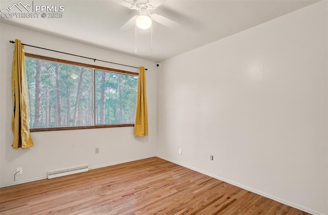 17990 Canterbury Dr, Monument, CO 80132 - spare room featuring a baseboard radiator, wood finished floors, and ceiling fan
