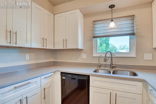 4472 Eastcrest Cir, Colorado Springs, CO 80916 - kitchen with dishwasher, a sink, white cabinetry, and light countertops