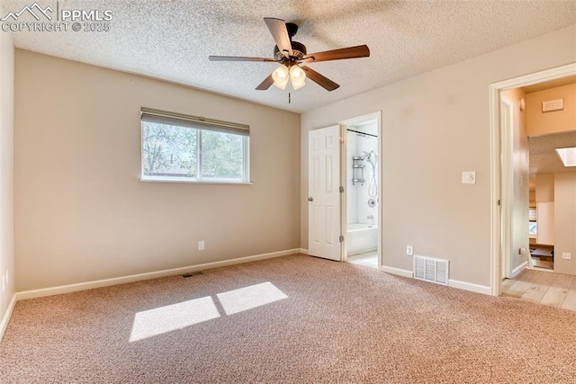 4472 Eastcrest Cir, Colorado Springs, CO 80916 - unfurnished bedroom featuring carpet flooring, a textured ceiling, ensuite bathroom, baseboards, and ceiling fan