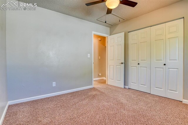 4472 Eastcrest Cir, Colorado Springs, CO 80916 - unfurnished bedroom with carpet, baseboards, a closet, a textured ceiling, and ceiling fan