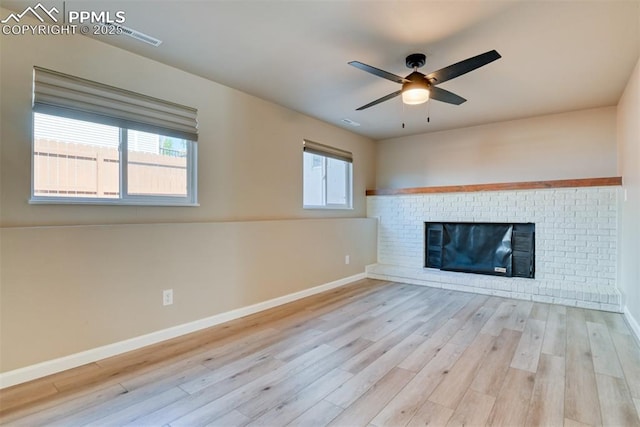 4472 Eastcrest Cir, Colorado Springs, CO 80916 - unfurnished living room with a ceiling fan, baseboards, wood finished floors, and a fireplace