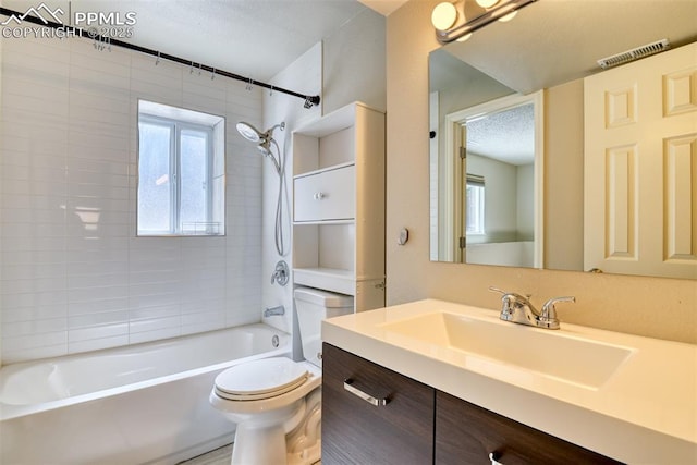 4472 Eastcrest Cir, Colorado Springs, CO 80916 - bathroom featuring toilet, shower / tub combination, vanity, and a textured ceiling