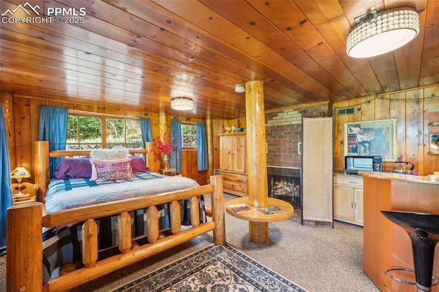 3875 Overlook Rd, Colorado Springs, CO 80906 - bedroom featuring wood ceiling, carpet, and wooden walls