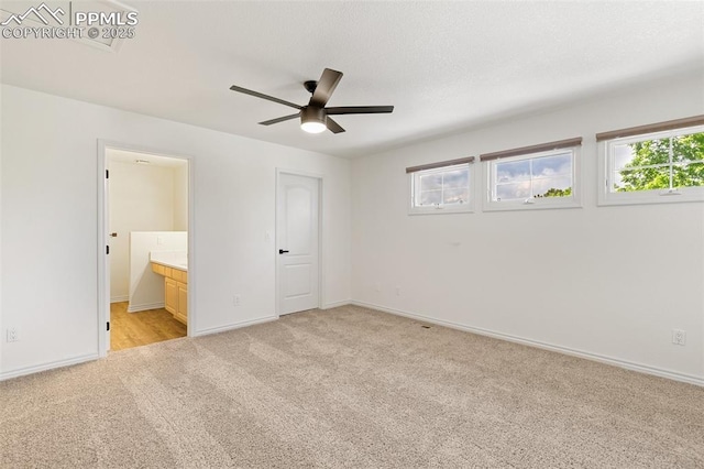 4430 Songglen Cir, Colorado Springs, CO 80906 - unfurnished bedroom featuring light carpet, baseboards, and connected bathroom