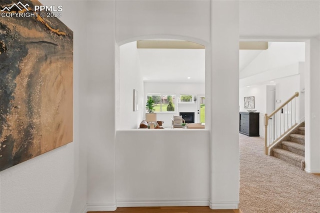 4430 Songglen Cir, Colorado Springs, CO 80906 - hall featuring arched walkways, stairs, and baseboards