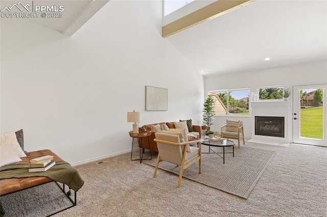 4430 Songglen Cir, Colorado Springs, CO 80906 - living room featuring carpet flooring, a fireplace with flush hearth, high vaulted ceiling, and baseboards