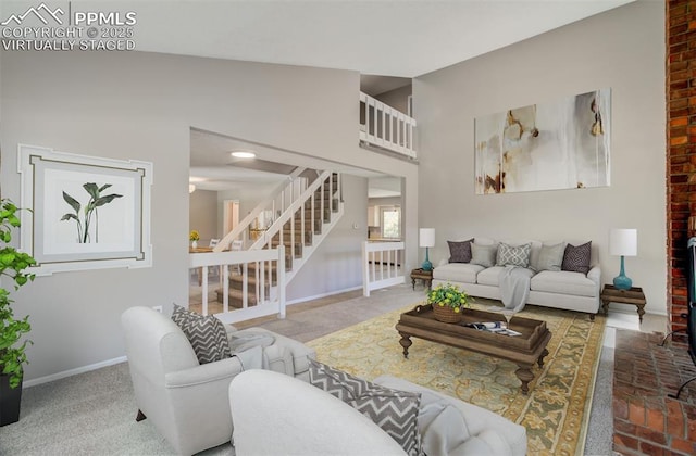 3177 Blue Mountain Way, Colorado Springs, CO 80906 - living area featuring stairway, baseboards, and a towering ceiling
