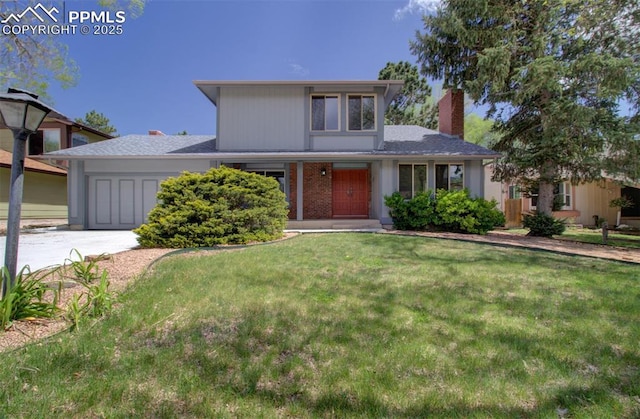 3177 Blue Mountain Way, Colorado Springs, CO 80906 - traditional-style home featuring an attached garage, a front lawn, concrete driveway, and a chimney