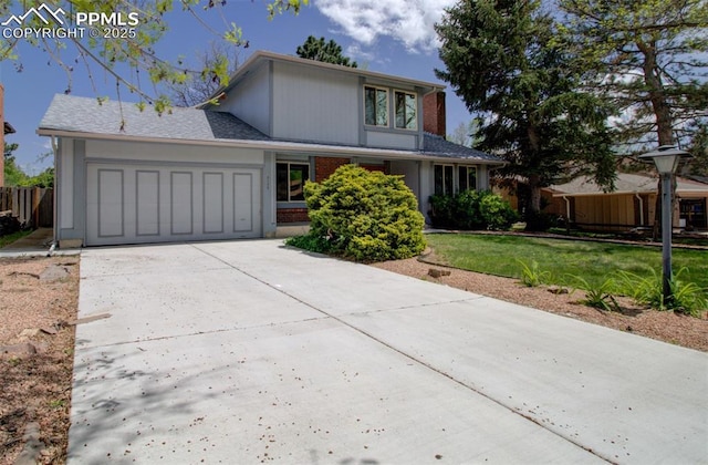 3177 Blue Mountain Way, Colorado Springs, CO 80906 - traditional home with a garage and driveway