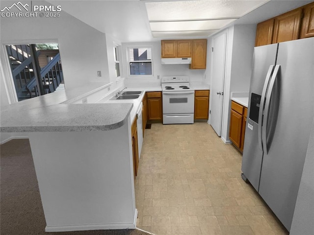 937 Moorings Dr, Colorado Springs, CO 80906 - kitchen with stainless steel refrigerator with ice dispenser, electric range, under cabinet range hood, brown cabinets, and a peninsula