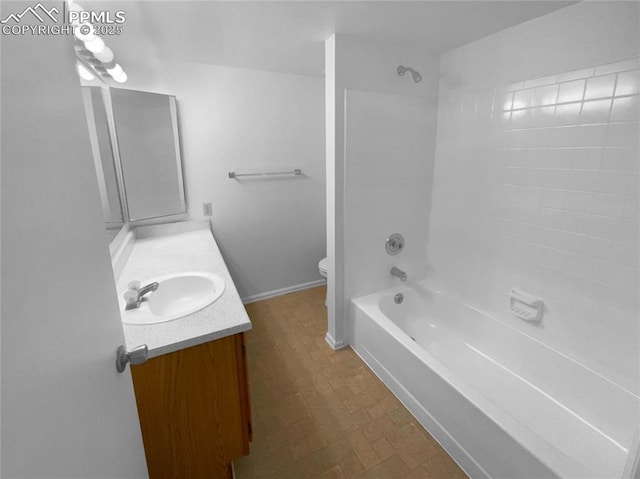 937 Moorings Dr, Colorado Springs, CO 80906 - full bathroom with vanity, toilet, shower / bath combination, and baseboards