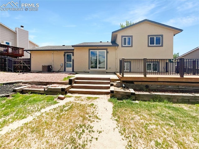 8193 Horizon Dr, Colorado Springs, CO 80920 - back of house featuring stucco siding, a deck, and central air condition unit