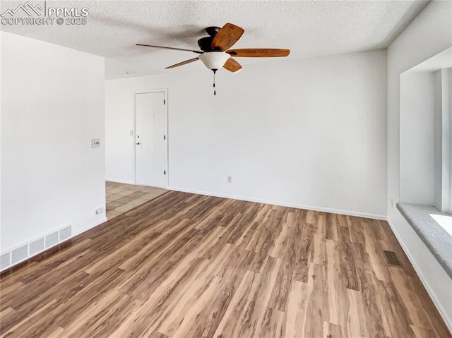 8193 Horizon Dr, Colorado Springs, CO 80920 - spare room featuring a ceiling fan, wood finished floors, a textured ceiling, and baseboards