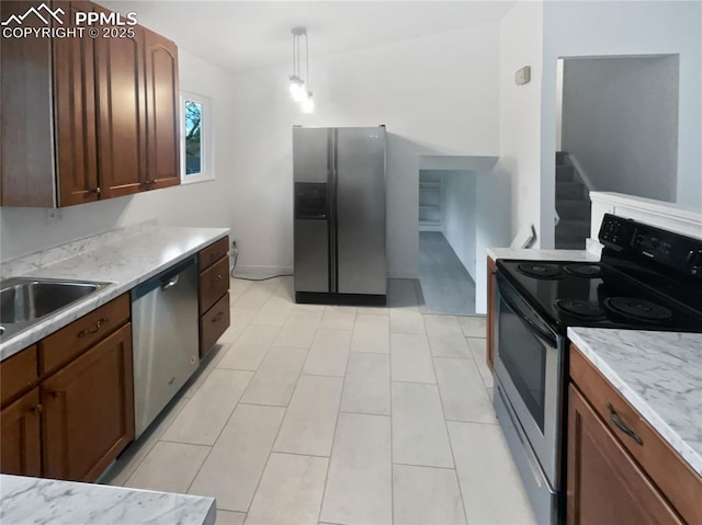 5570 Whimsical Dr, Colorado Springs, CO 80917 - kitchen with appliances with stainless steel finishes, light countertops, and a sink