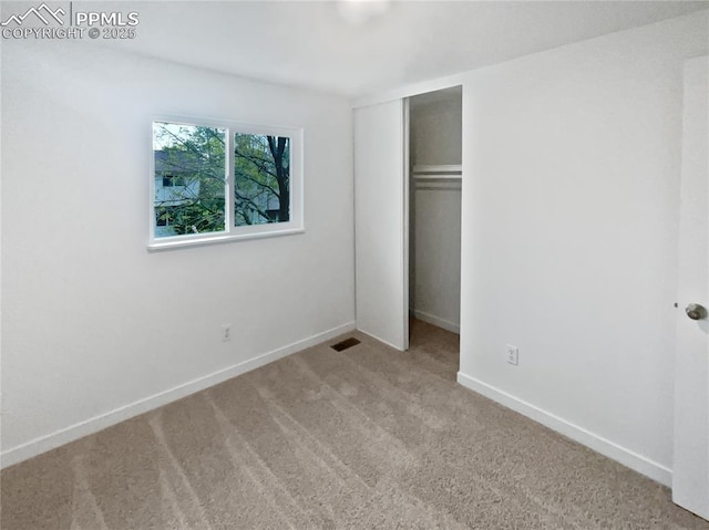 5570 Whimsical Dr, Colorado Springs, CO 80917 - unfurnished bedroom featuring carpet floors, a closet, and baseboards