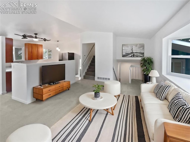 5570 Whimsical Dr, Colorado Springs, CO 80917 - living room featuring light carpet, ceiling fan, lofted ceiling, and baseboards