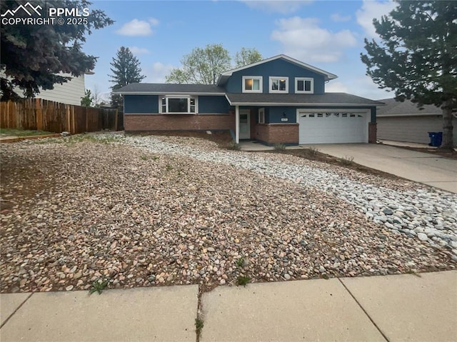 5570 Whimsical Dr, Colorado Springs, CO 80917 - view of front of house featuring brick siding and concrete driveway
