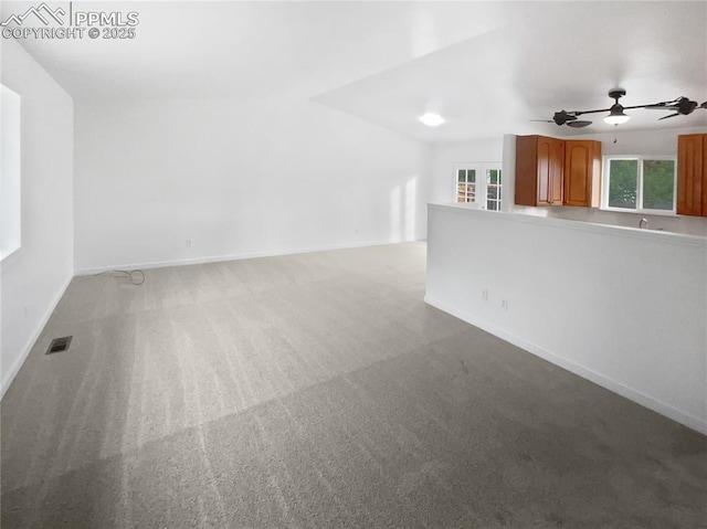 5570 Whimsical Dr, Colorado Springs, CO 80917 - unfurnished living room featuring ceiling fan, carpet floors, and baseboards