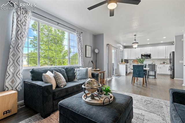 14213 Woodrock Path, Colorado Springs, CO 80921 - living area with plenty of natural light, a ceiling fan, baseboards, light wood finished floors, and recessed lighting