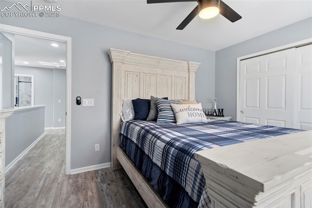 14213 Woodrock Path, Colorado Springs, CO 80921 - bedroom with wood finished floors, baseboards, a closet, a ceiling fan, and recessed lighting