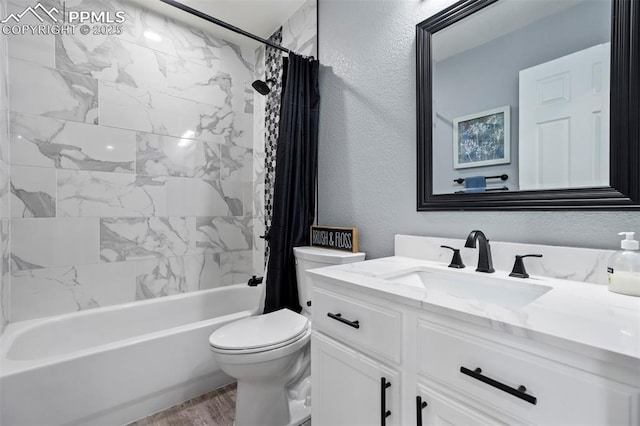 14213 Woodrock Path, Colorado Springs, CO 80921 - full bathroom with a textured wall, vanity, toilet, shower / bath combo with shower curtain, and wood finished floors