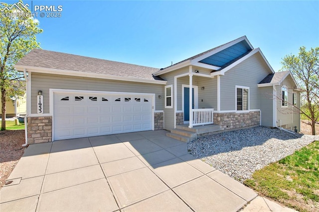 11933 Corbu Hts, Peyton, CO 80831 - craftsman house featuring stone siding, a garage, and driveway