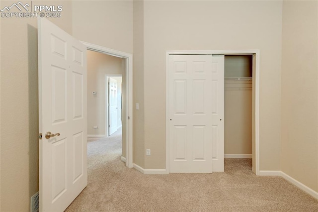 11933 Corbu Hts, Peyton, CO 80831 - unfurnished bedroom with light colored carpet, a closet, and baseboards