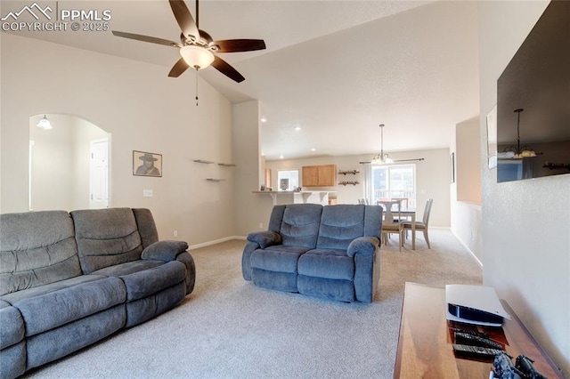 11933 Corbu Hts, Peyton, CO 80831 - living room with light colored carpet, a ceiling fan, arched walkways, lofted ceiling, and baseboards