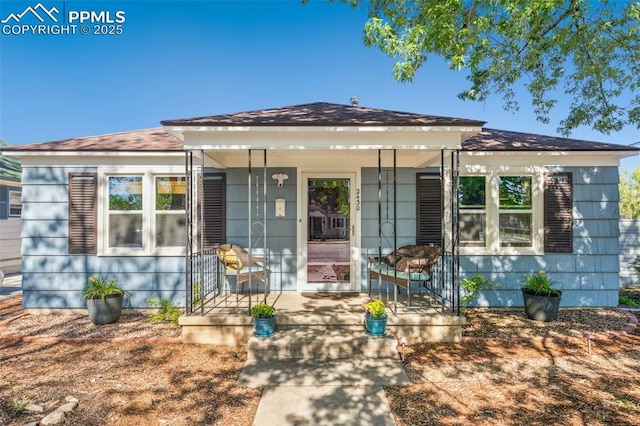 2430 N Tejon St, Colorado Springs, CO 80907 - view of front facade with covered porch and roof with shingles