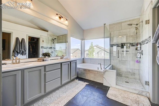 10368 Mount Evans Dr, Peyton, CO 80831 - bathroom featuring lofted ceiling, a garden tub, a stall shower, and double vanity