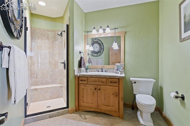 18320 Table Rock Rd, Colorado Springs, CO 80908 - full bathroom with a stall shower, toilet, vanity, and tile patterned flooring